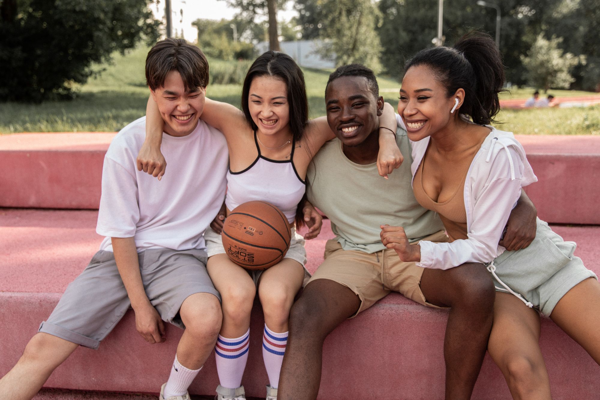four friends with a basketball