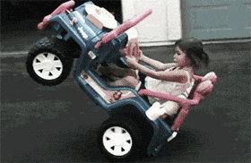 Little girl driving toy car
