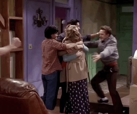 Cast of Friends hugging each other