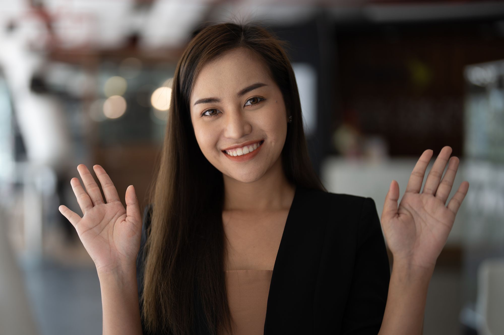 Asian girl waving